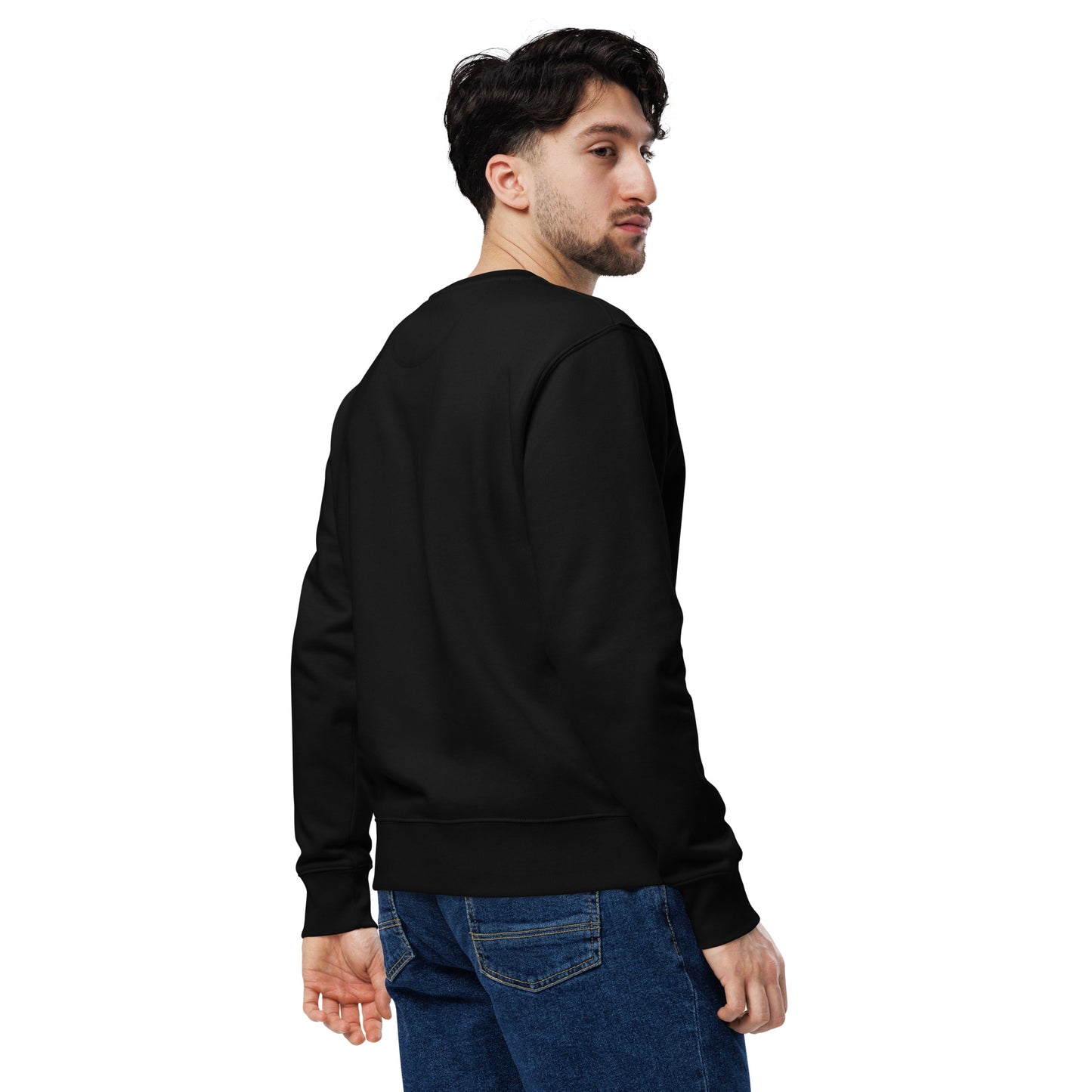Man wearing a black sweatshirt and blue jeans on a white background